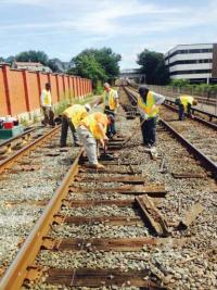 Workers fix up tracks between North Quincy and JFK stations. 	Photo courtesy Mass DOT